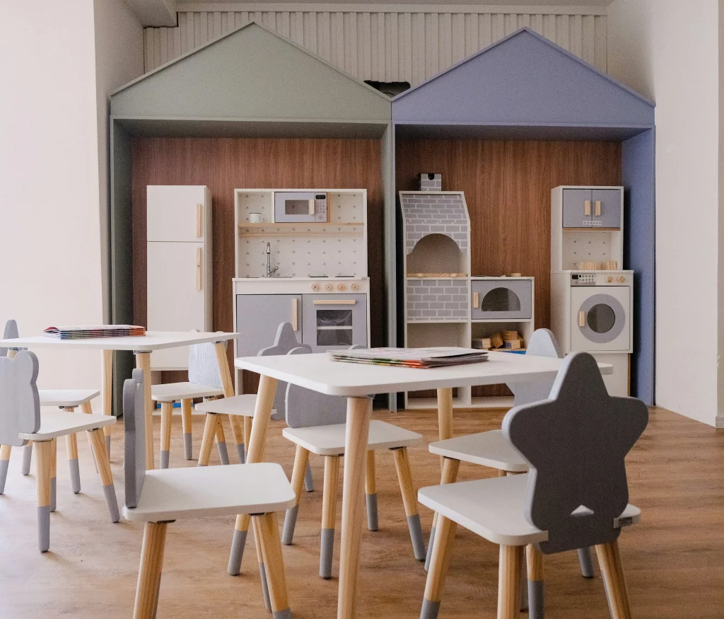 Playroom with toy kitchens and children's tables, relevant to our association.